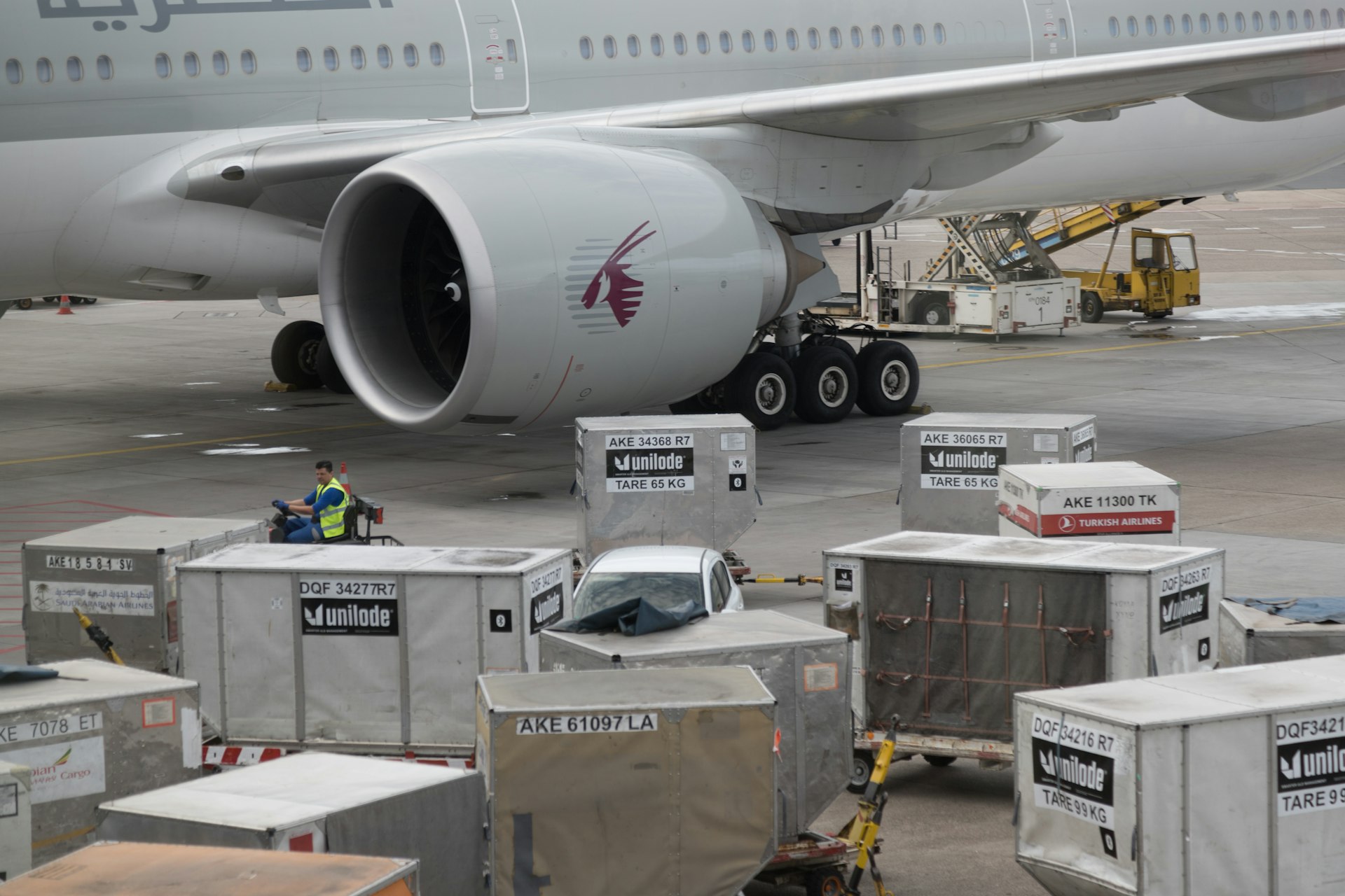 a large airplane is being loaded with luggage